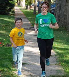 Dr. Kim Kelly, AMA CSH Representative, and her son out for a run.