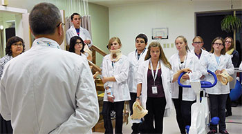 Camrose physician, Dr. Christopher Nichol helps junior high students get a glimpse into the world of medicine.